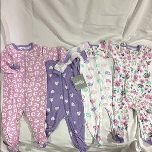 Onesie Brand 4 pack Purple and White brand new a whole pack